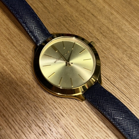 Beautiful authentic gold Michael Kors watch with a navy blue leather strap. - Picture 1 of 3